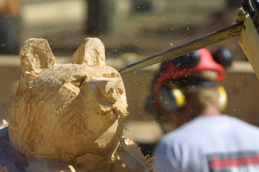 carving with a chain saw at a lumberjack competition
