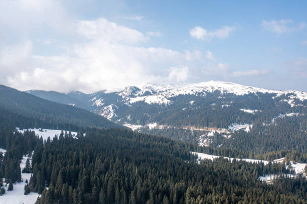 istock Clouds and mists drown the snow mountain 1721252241