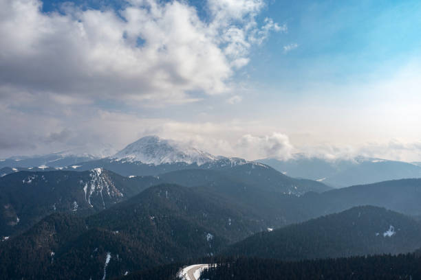 Clouds and mists drown the snow mountain