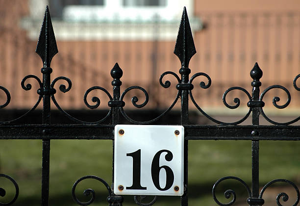 istock cast iron fence and house number 16 172125559