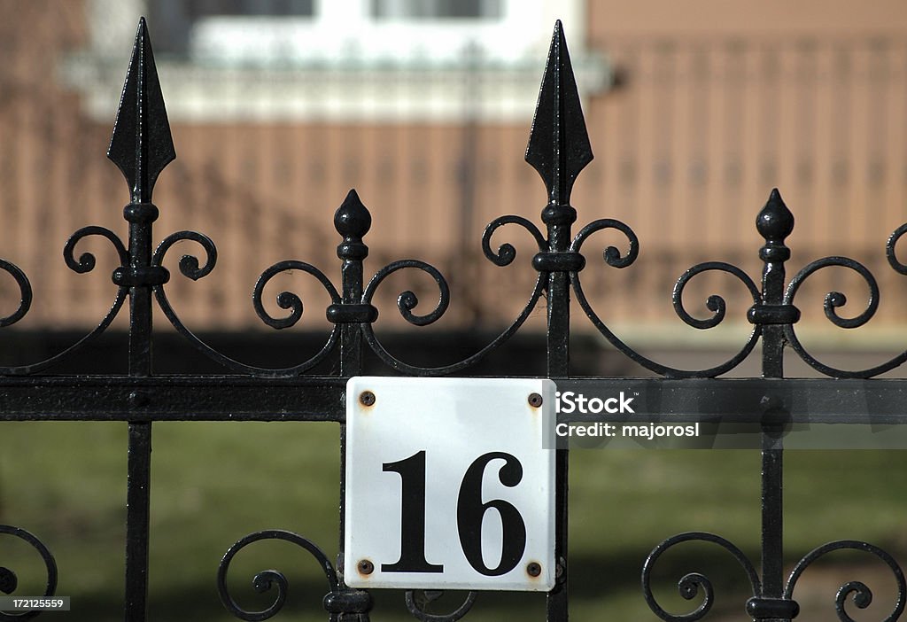 cast iron fence and house number 16 Abstract Stock Photo