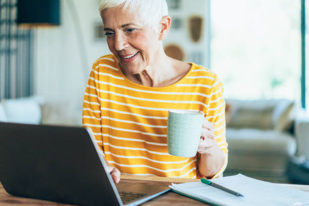istock Senior woman at Home office 1721257697