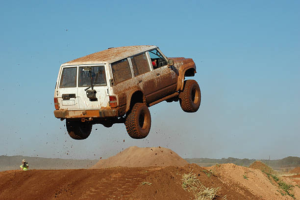 Offroad Racing White SUV jumping in an Offroad Race stunt stock pictures, royalty-free photos & images