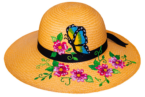 A handmade straw Panama hat, a Paja Toquilla hat or a sombrero with embroidered flowers. Ecuador. Popular souvenir from South America.