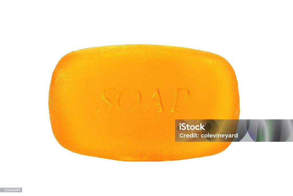 A single bar of orange soap on a white background Bar of Soap Bar Of Soap Stock Photo