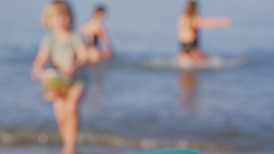 Anonymous Children Having Fun in Shallow Sea Water on Sunny Summer Day