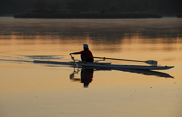 morning rowing routine stock photo