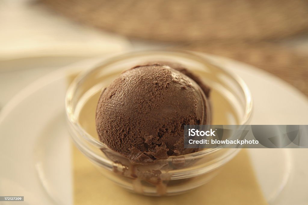 Venice: Gelato Chocolate gelato melting in the hot Venetian sun. Bowl Stock Photo