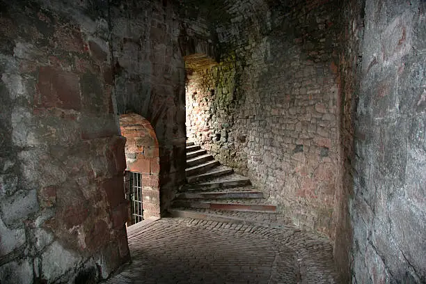 Brick passage wall with two doorways in a old building