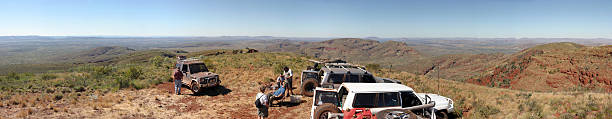 Monterrey Nuevo Leon. Mexico. An all road jeep vehicle goes through a rock and mud obstacle in a sunny day.