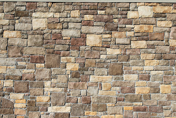 Brown multitonal stone wall texture background stock photo