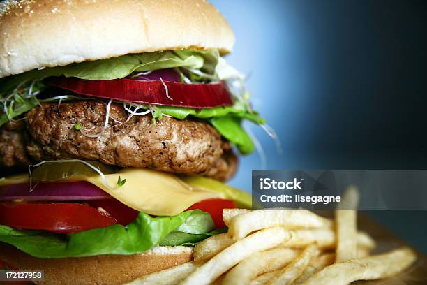 Hamburger Close Up On Blue Stock Photo - Download Image Now - Alfalfa, Blue, Bread