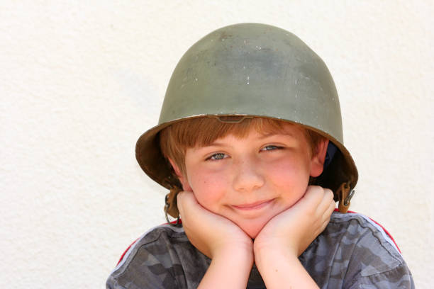 istock Boy in an Old Army Helmet three 172128148