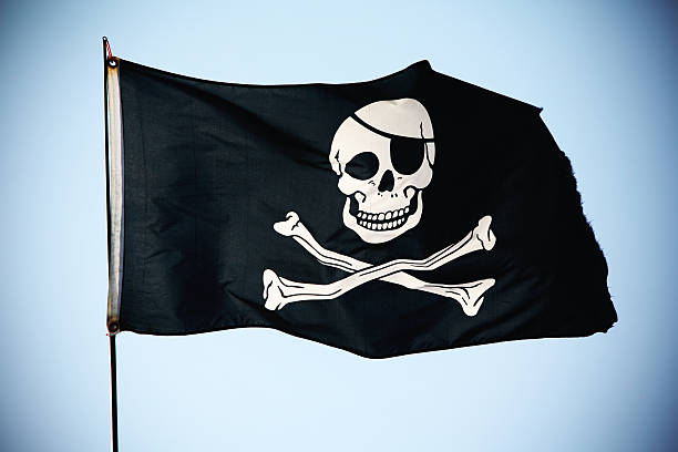 Pirate Flag XL The infamous Jolly Roger with frayed edges. pirate flag stock pictures, royalty-free photos & images