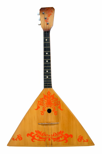 This balalaika is isolated on white.