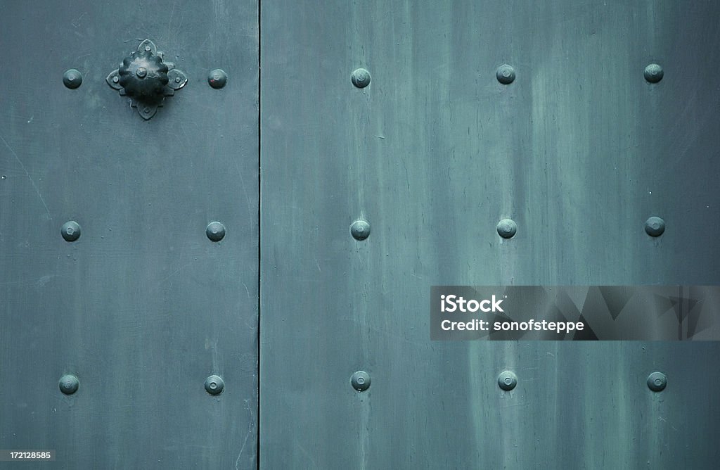 Antique Door Patinated door detail from a Croatian little town Cavtat. Metal Stock Photo