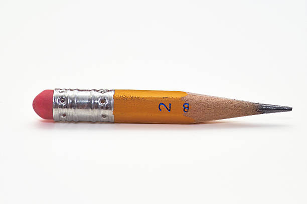 Number 2 Pencil Stub II Side view of a number 2 pencil stub, macro photo on isolated white background. nub stock pictures, royalty-free photos & images