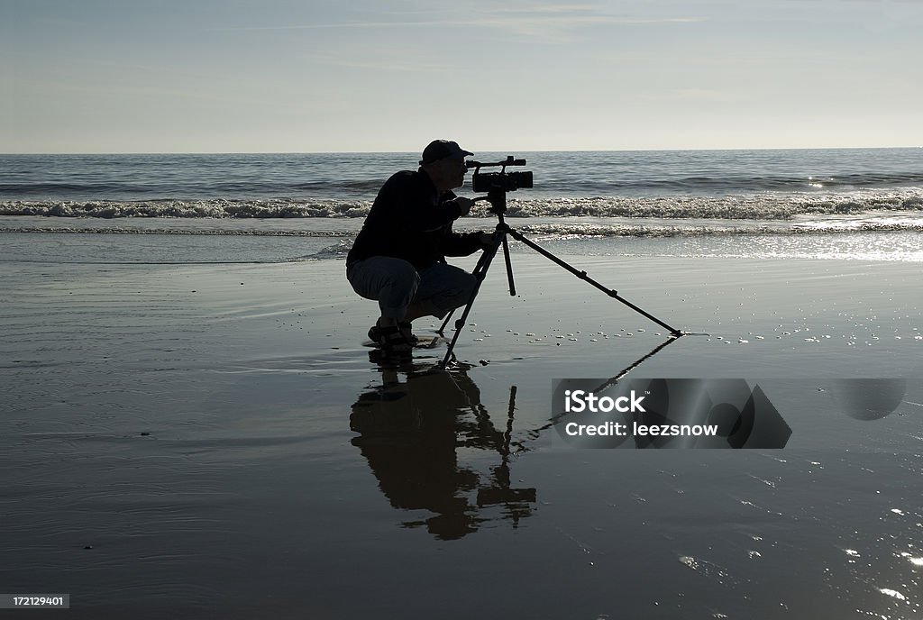 Videografo Silhouette - Foto stock royalty-free di Accovacciarsi