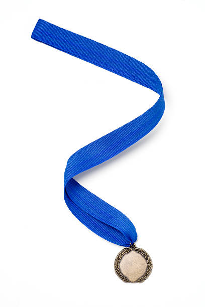 Gold Medal Award on a Blue Ribbon stock photo