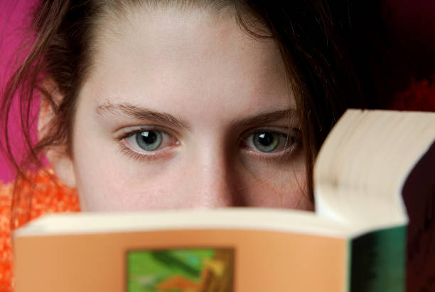 istock Teenage girl reading a book 172129477