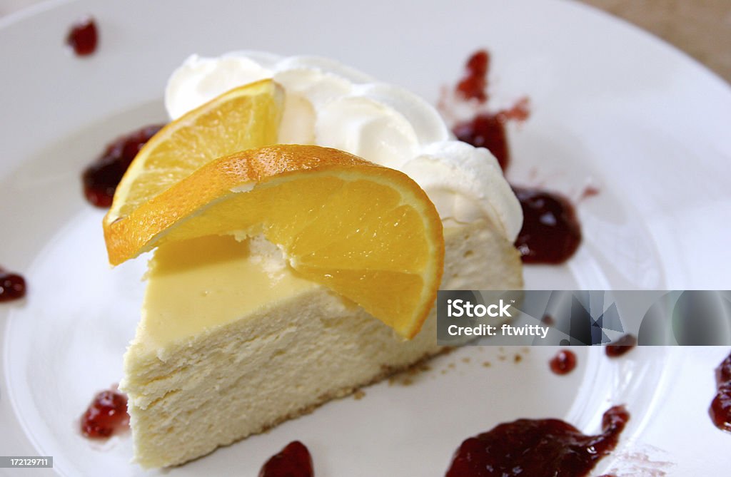Citrus Cheesecake Citrus cheesecake with orange and raspberry Baking Stock Photo