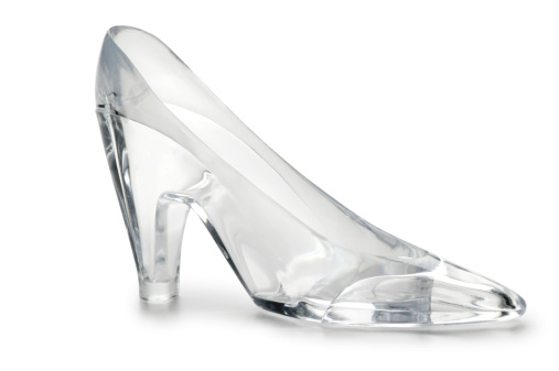 A glass slipper on white with soft shadow