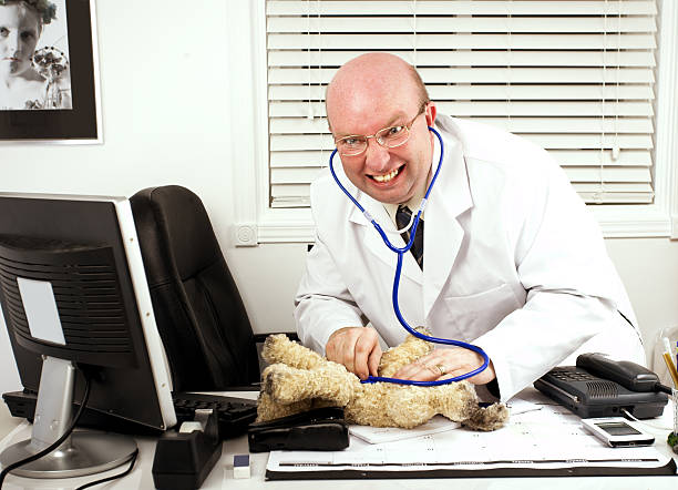 Veterinarian using a stethoscope on a cat at animal clinic