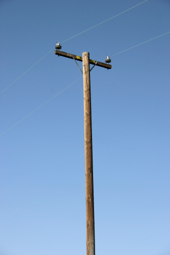 lone electric pole with power lines