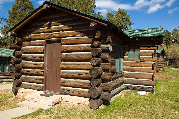 Log Cabins Rustic log cabins in a national park. summer camp cabin stock pictures, royalty-free photos & images