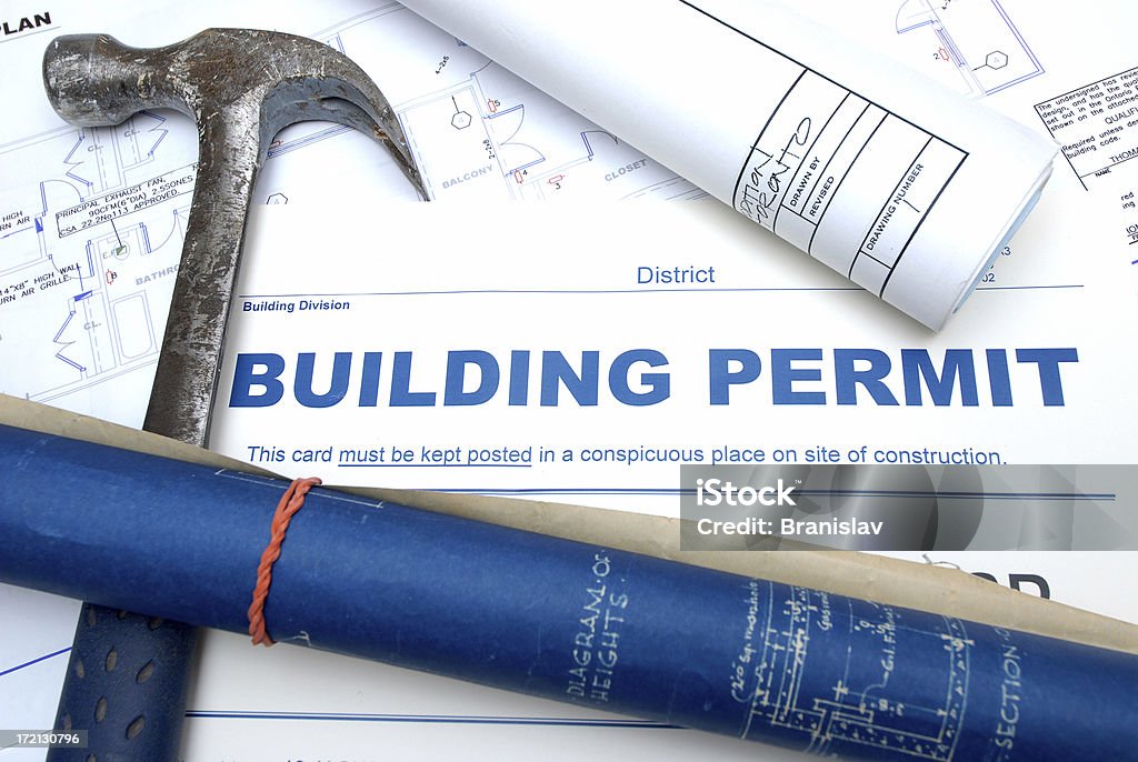 building permit building permit and blueprints Authority Stock Photo