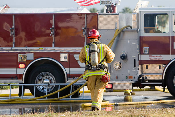 Firefighter in action at night and in blurred motion