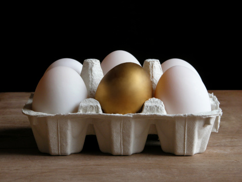 A golden egg turns up in an egg carton.