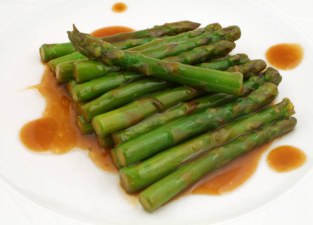 Fresh white asparagus from Beelitz (Germany) on a plate with sauce hollandaise.