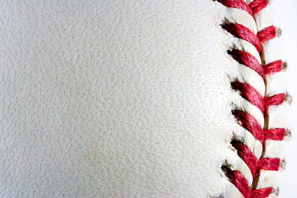 Baseball Background Baseball with seams on the right. baseball threads stock pictures, royalty-free photos & images