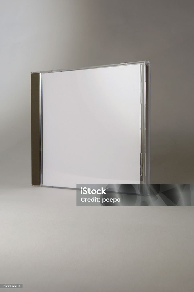 blank CD box add text and graphics Blank CD jewel case against gray background - white cover to add text.graphics to - shallow depth of field CD Case Stock Photo