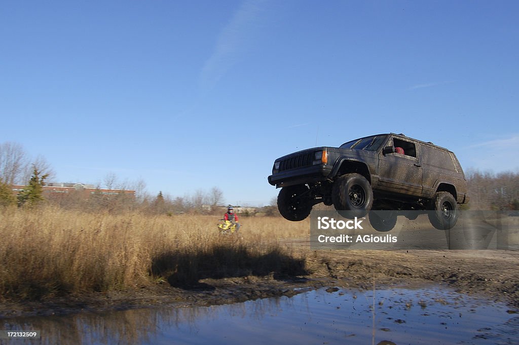 Jeep Jumping over a Puddle This picture of a jeep was taken in December of 2006 with a Nikon D50. Mid-Air Stock Photo