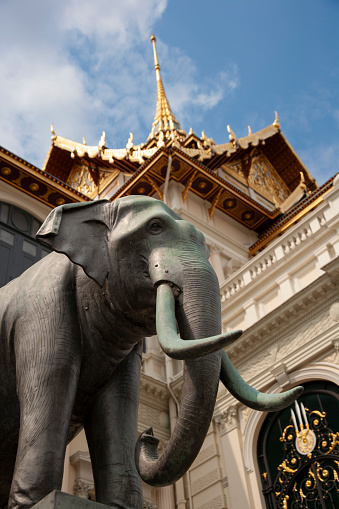 Bangkok, Thailand - April 5, 2011: Elephant statue at Phra Thinang Chakri Maha Prasat, a building with a blend of Thai traditional architecture and a combination of 19th-century European styles.
