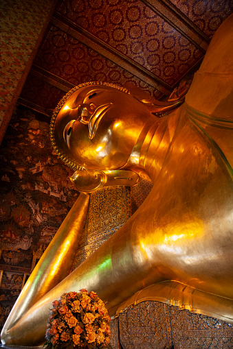 Reclining Buddha at Wat Pho Thai, a Buddhist temple complex in the Phra Nakhon District, Bangkok, Thailand