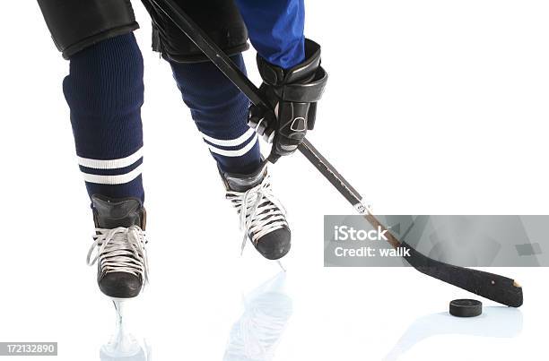Closeup On Hockey Player Legs Stock Photo - Download Image Now - Activity, Aggression, Blue