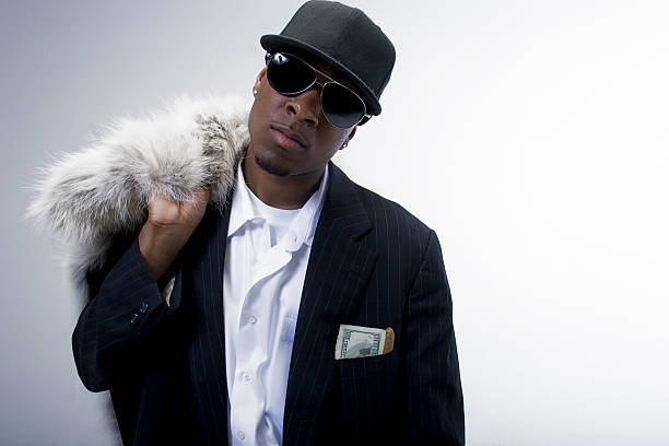 Celebrity Status Series Man with fur coat and shades. pimp hat stock pictures, royalty-free photos & images