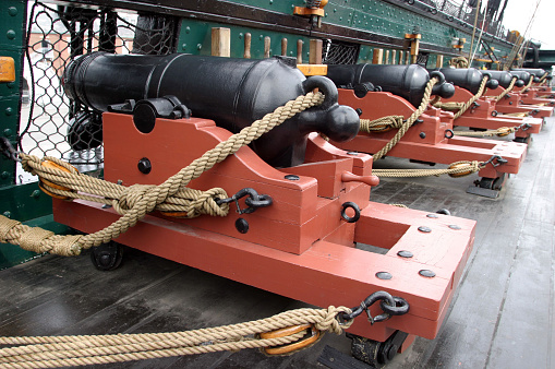 Row of cannons on Old Ironside, USS Constitution, the oldest commissioned ship in the US Navy.