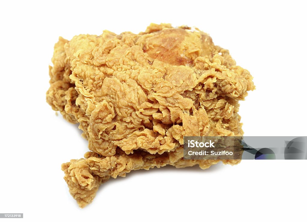 fried chicken thigh A crispy golden fried chicken thigh, isolated on white. American Culture Stock Photo