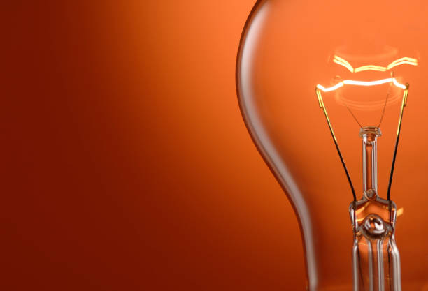istock Close Up of Lightbulb With Glowing Filament 172134334