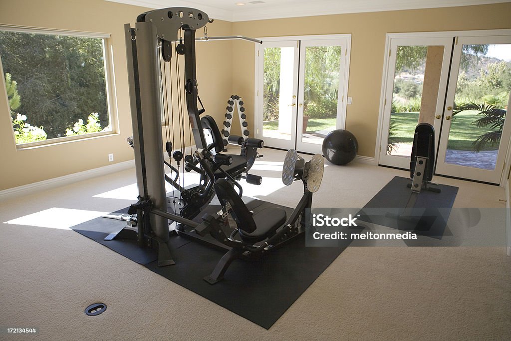 Home Gym Wide angle shot of a home gym in a nice house. Home Interior Stock Photo