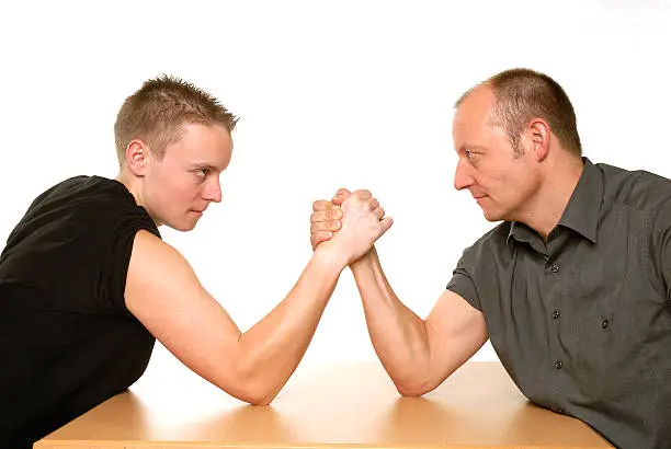 armwrestling between father and son