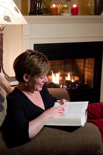 istock Laughing at a good book by the fireplace 172134683