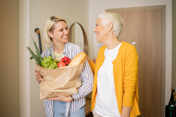 istock Volunteer is helping an elderly woman 1721353088