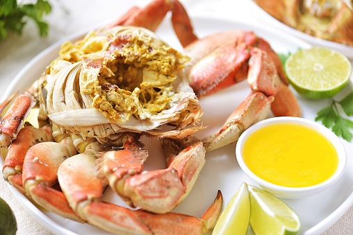 Boiled crab with lime juice butter sauce and garlic