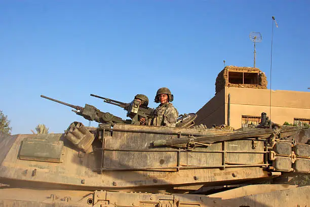 M1 Abrams Main Battle Tank crew prepares for combat patrol in Ramadi, Iraq. 