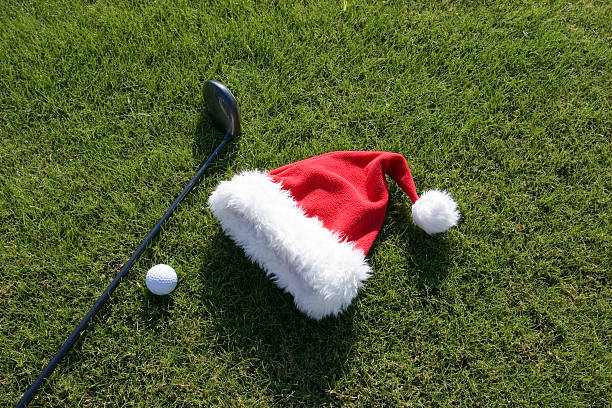 istock SANTA HAT WITH GOLF CLUB AND BALL 172141038